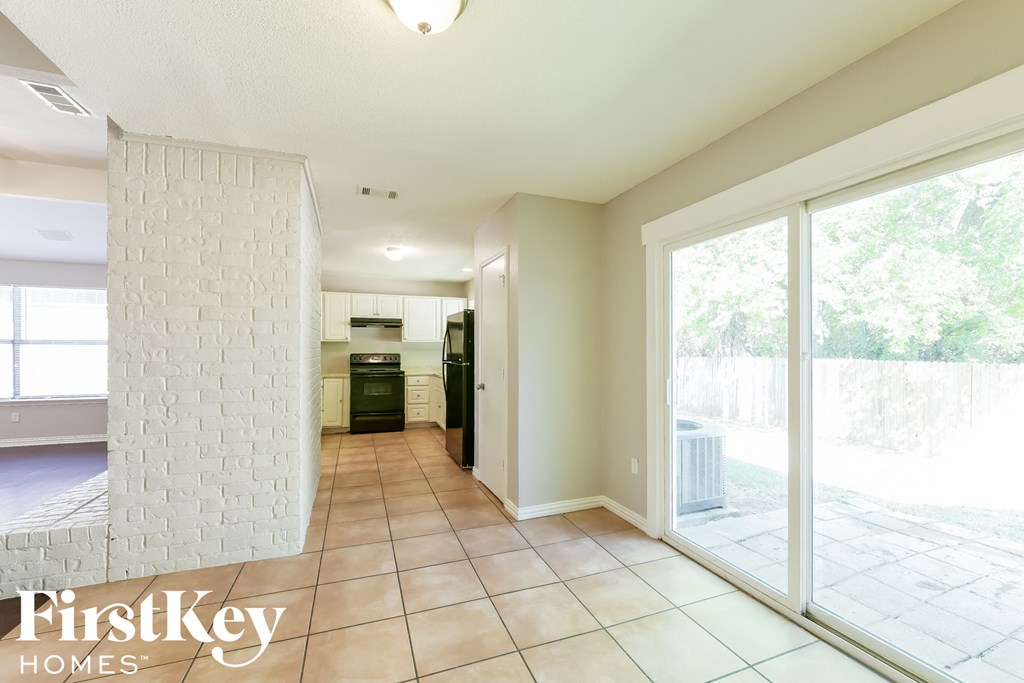 a view of the living room and kitchen from the patio doors