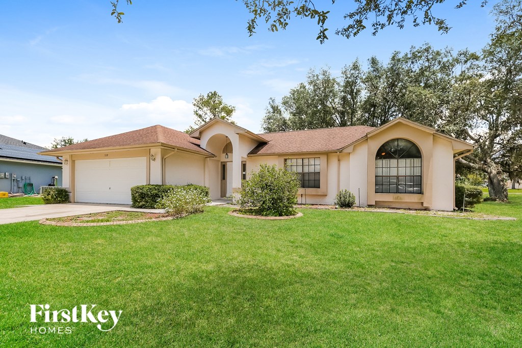 a house with a lawn in front of it