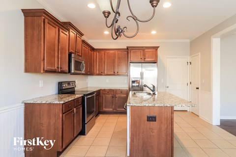 a kitchen with wooden cabinets and a counter top