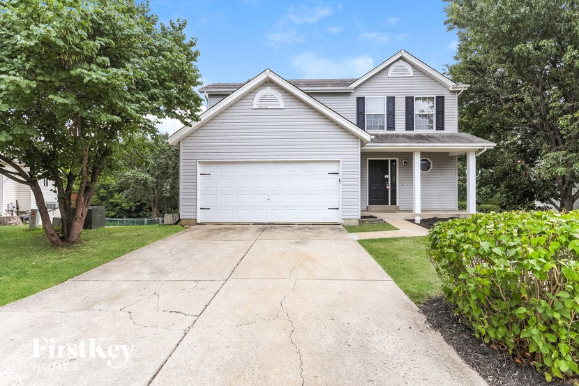 a white house with a white garage door