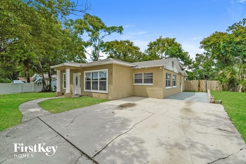A house with a driveway in front of it.