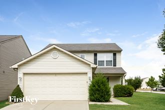 a white garage door in front of a house