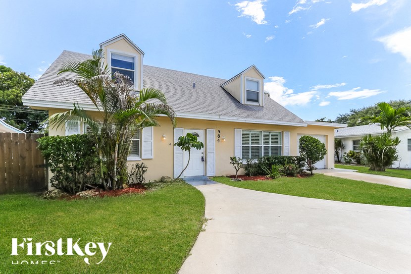 A house with a white door and a small porch.