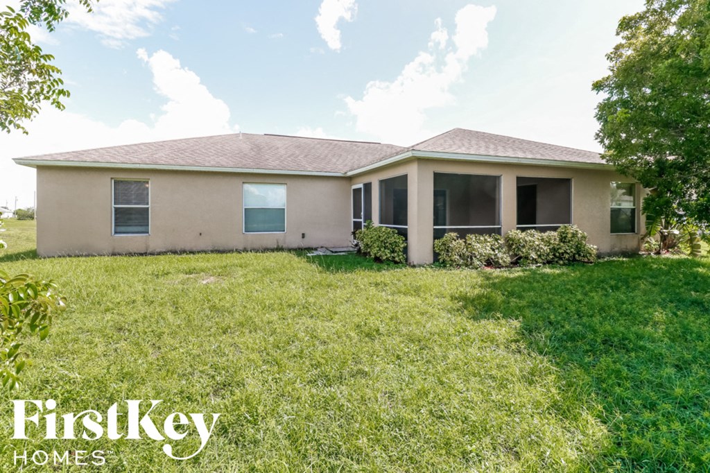 A house with a lawn in front of it.