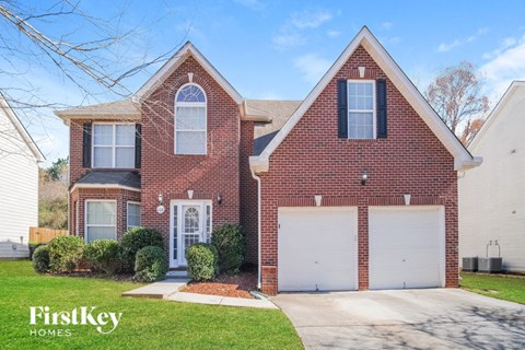 a brick house with a white garage door