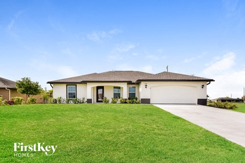 a house with a lawn in front of it