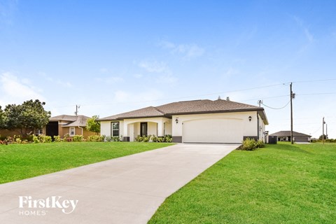 a home with a driveway and a garage door