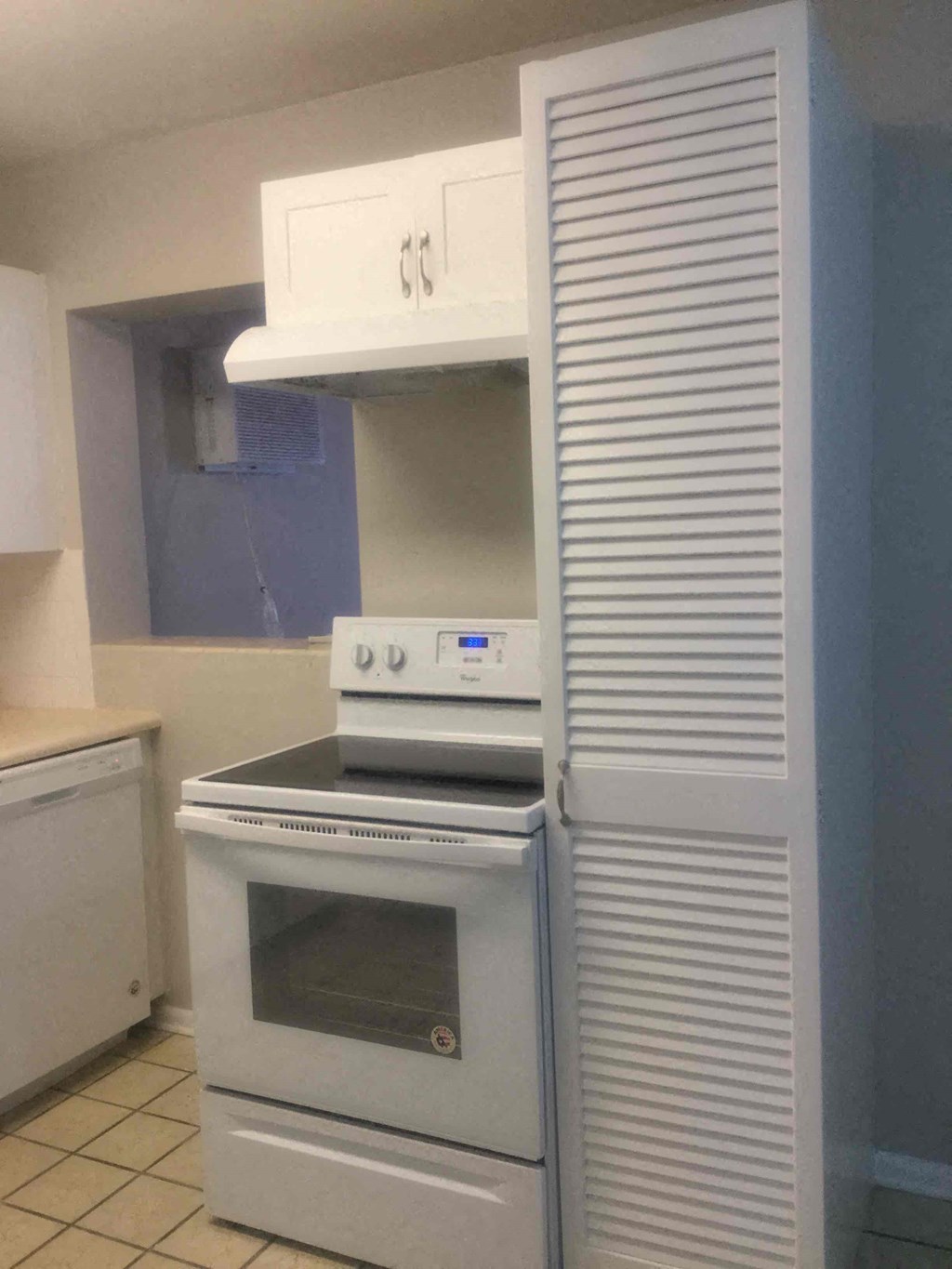 a kitchen with a stove and a refrigerator