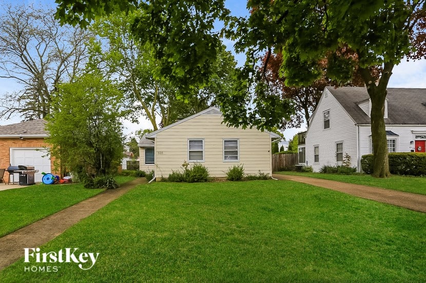 A house with a lawn in front of it.