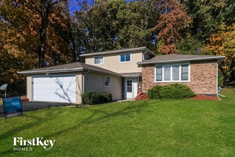 a home with a lawn in front of it