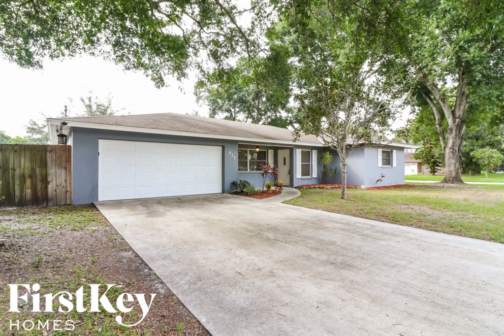 A house with a garage is for sale by FirstKey Homes.