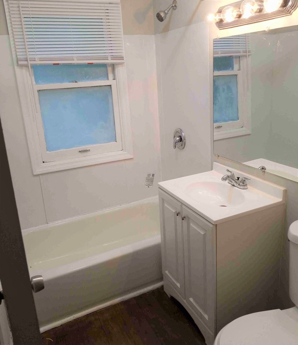 a bathroom with a sink and a bath tub