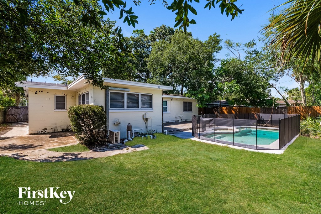 A house with a pool in the backyard.