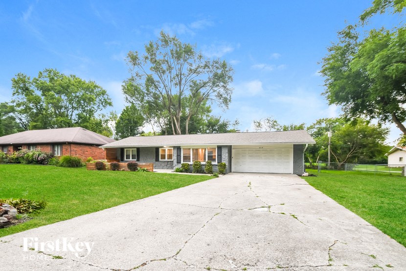 A house with a driveway in front of it.