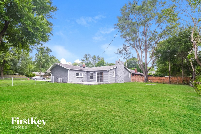 A house with a lawn in front of it.