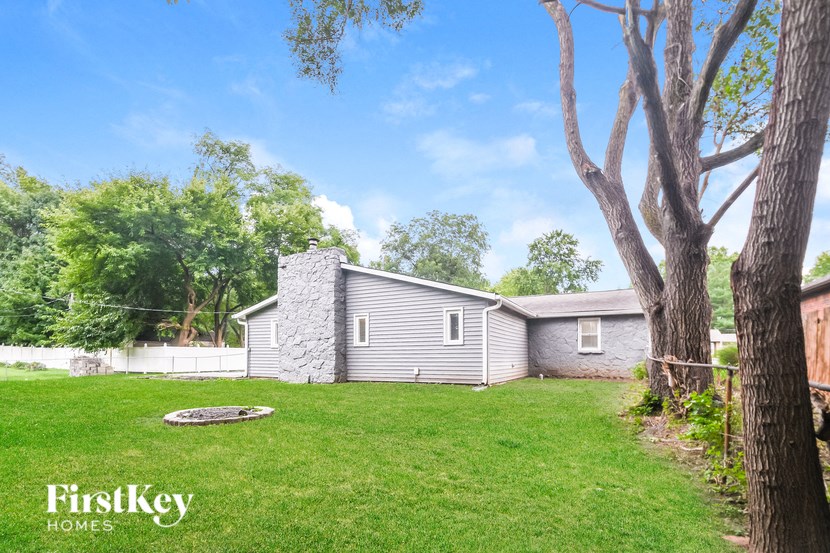 A house with a tree in front of it.
