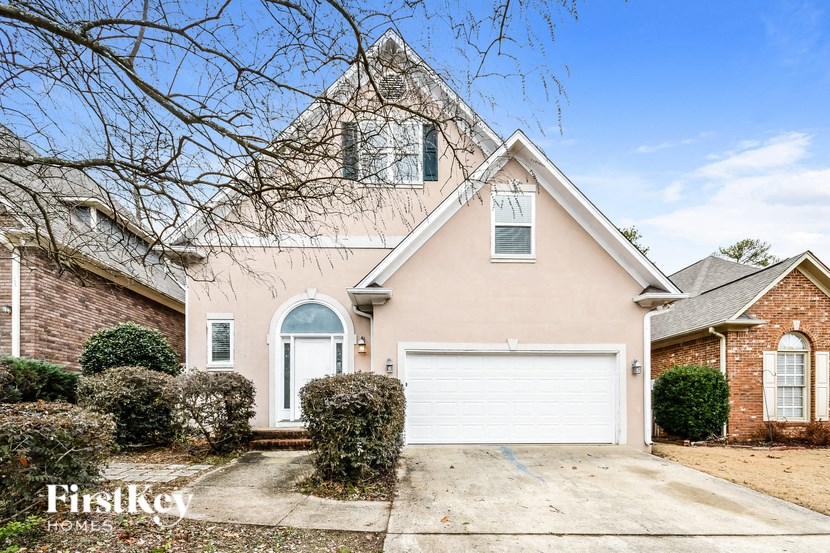 a house with a white garage door in front of it