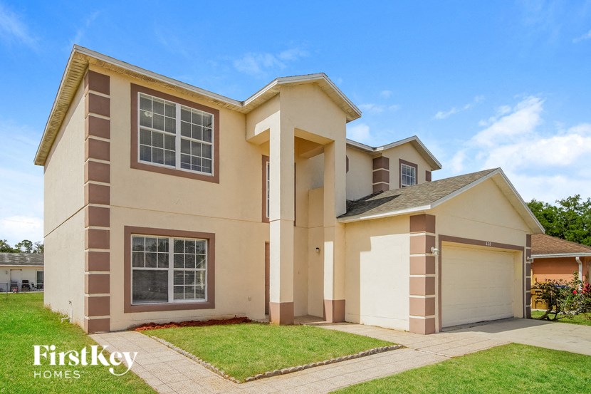 A two-story house with a garage is for sale by Firstkey Homes.