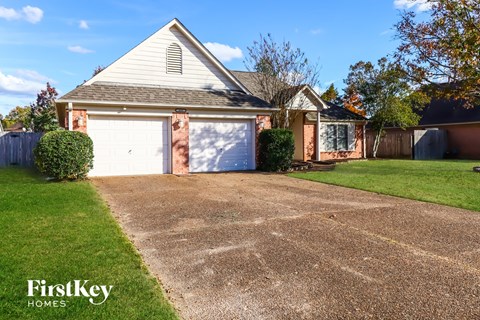 A house with a driveway and a garage door.
