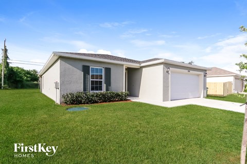 a small house with a lawn in front of it