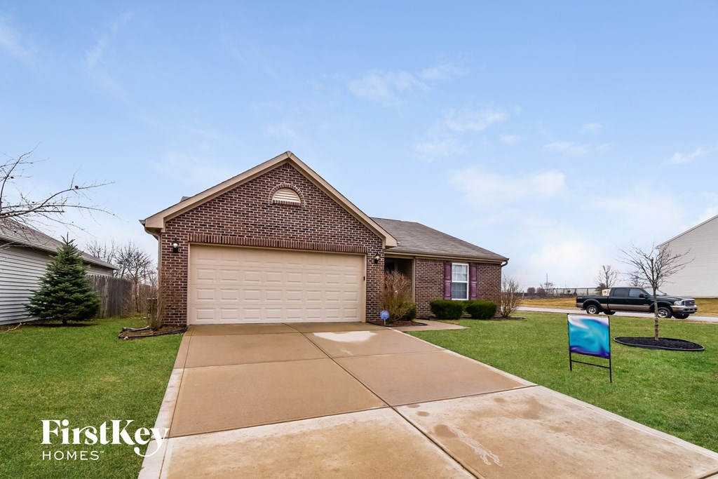 a house with a driveway and a garage door