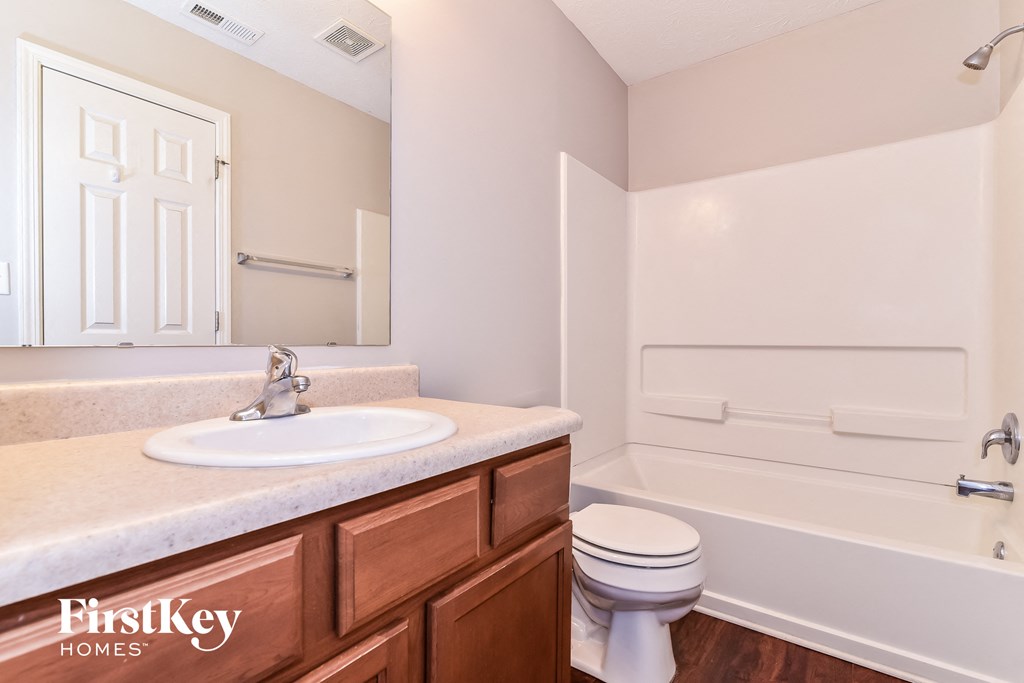 an image of a bathroom with a sink and a toilet