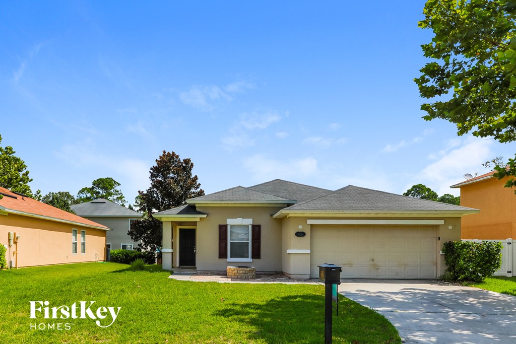 A house with a garage is for sale by FirstKey Homes.