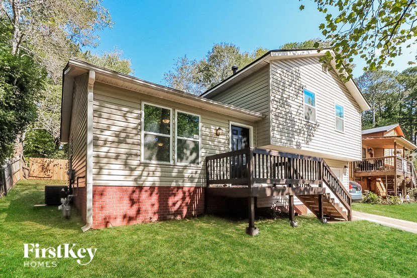 a small house with a porch and a deck