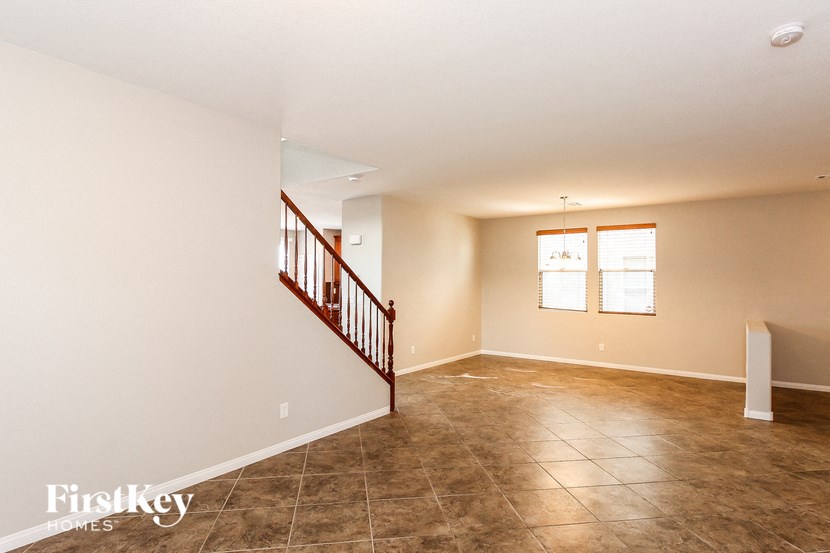 A room with a staircase and a window.
