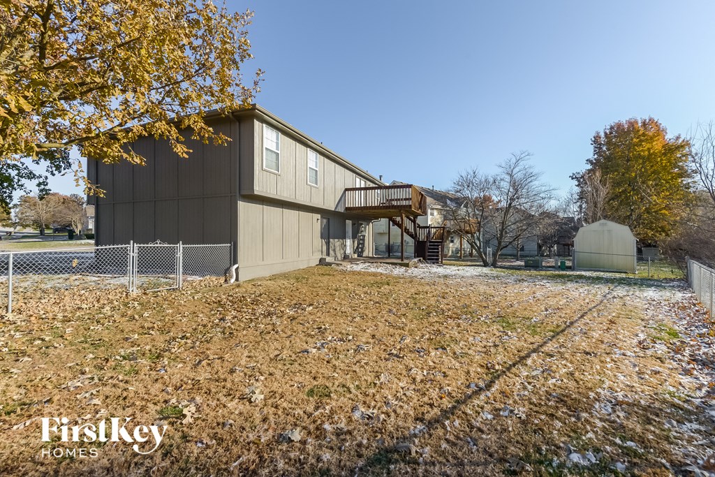 a view of a house with a yard in front of it