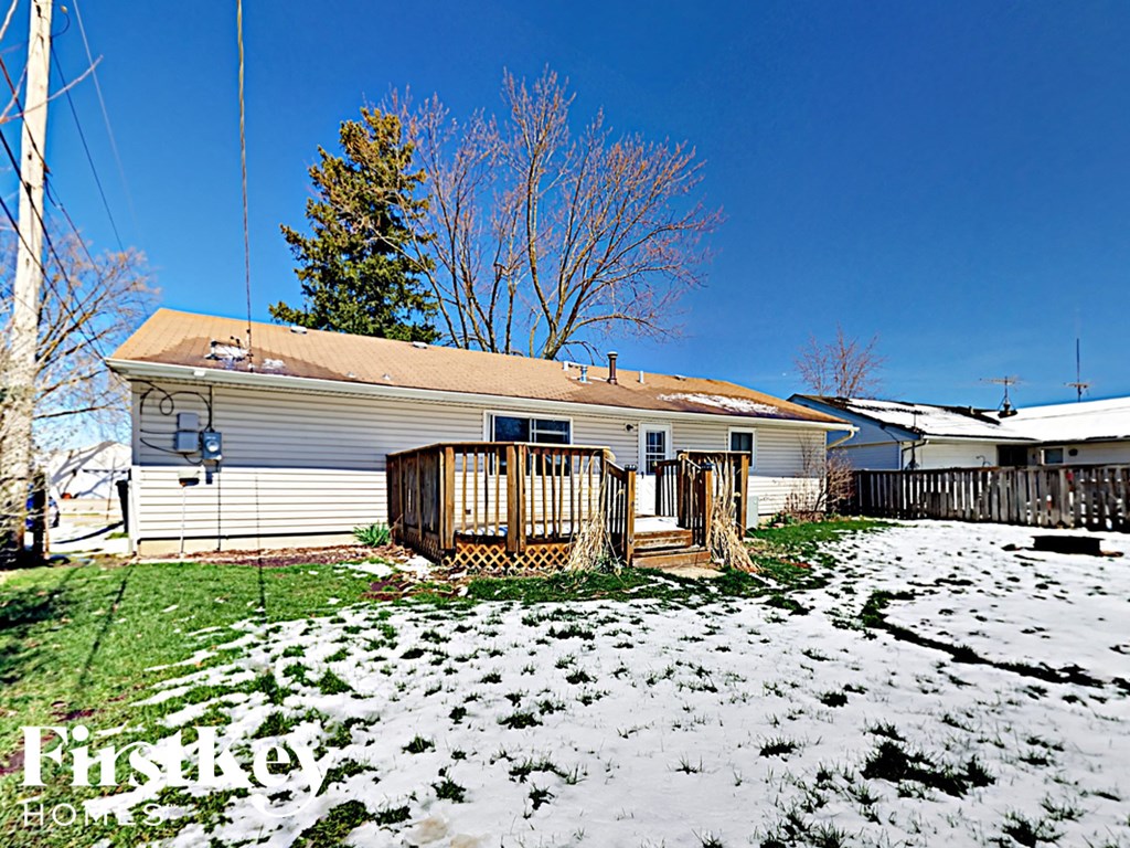 a house with a yard covered in snow