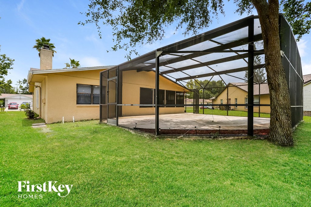 a house with a patio and a tree