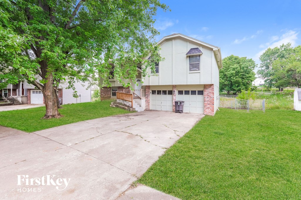 A house with a garage is for sale.