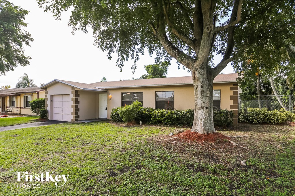 a house with a tree in front of it