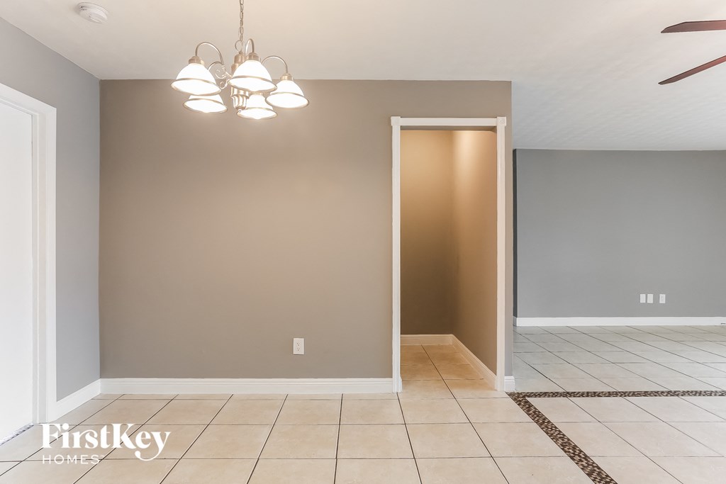 the living room and dining room with a door to the closet
