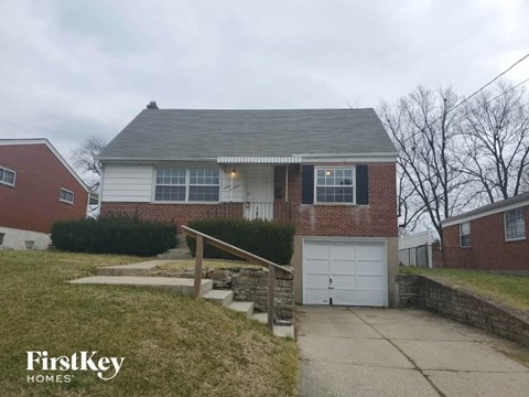 A house with a garage is for sale by FirstKey Homes.