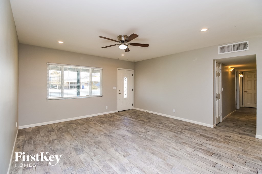 the living room is open to the dining room and kitchen