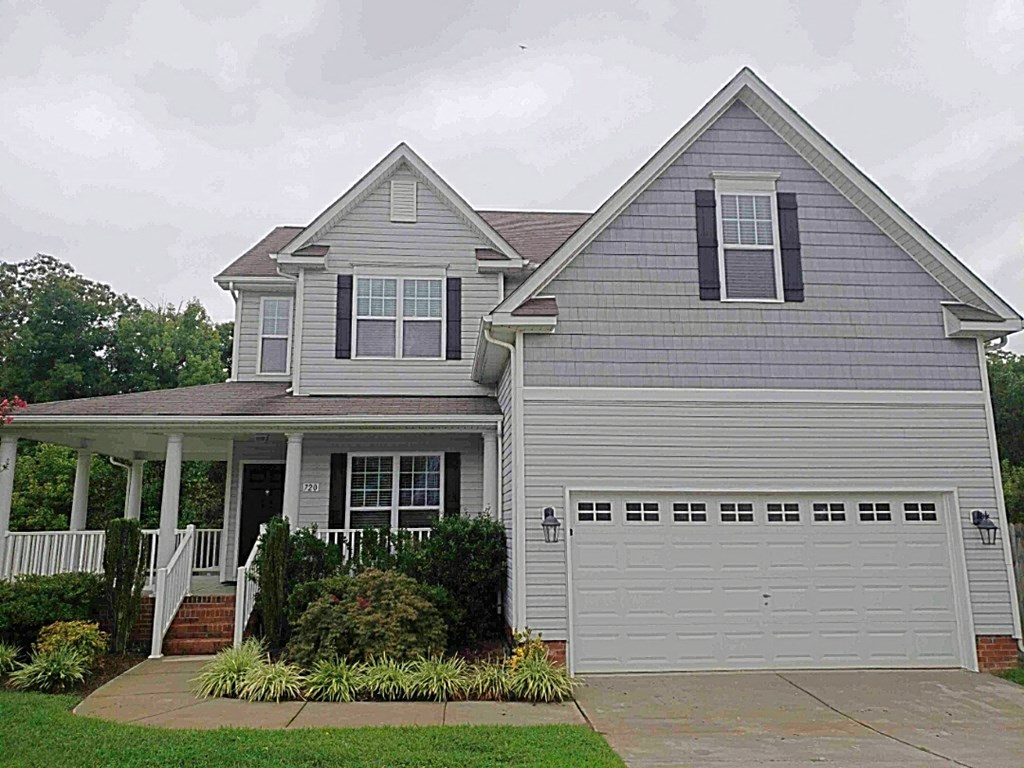 A two-story house with a garage.