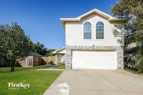 a white house with a white garage door