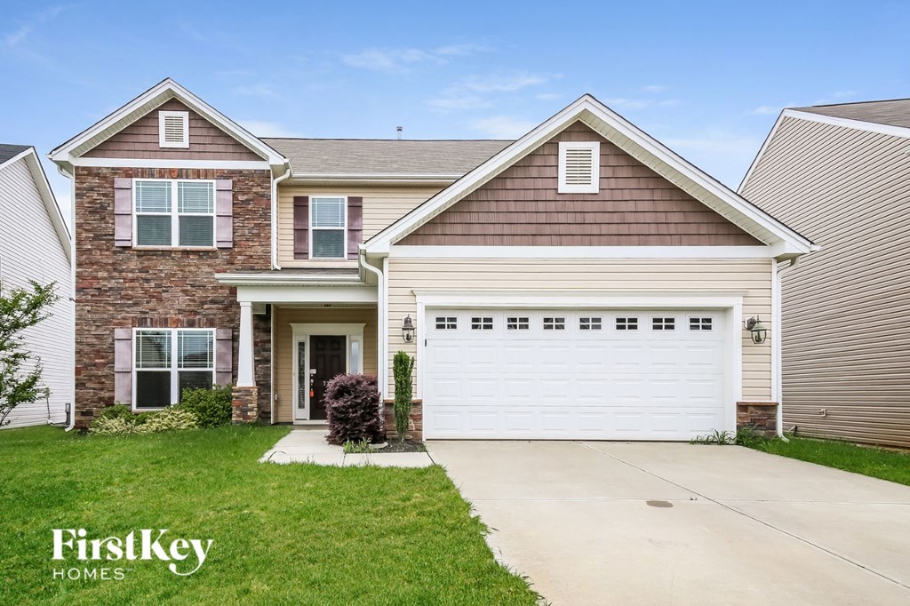 a suburban house with a white garage door
