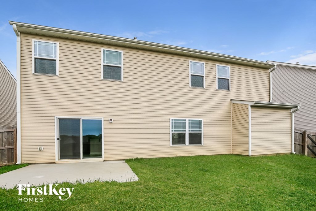the exterior of a home with a yard and a sidewalk