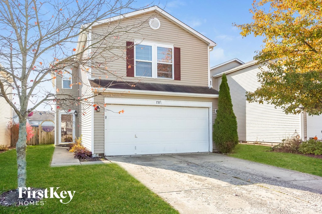 A house with a garage is for sale by FirstKey Homes.