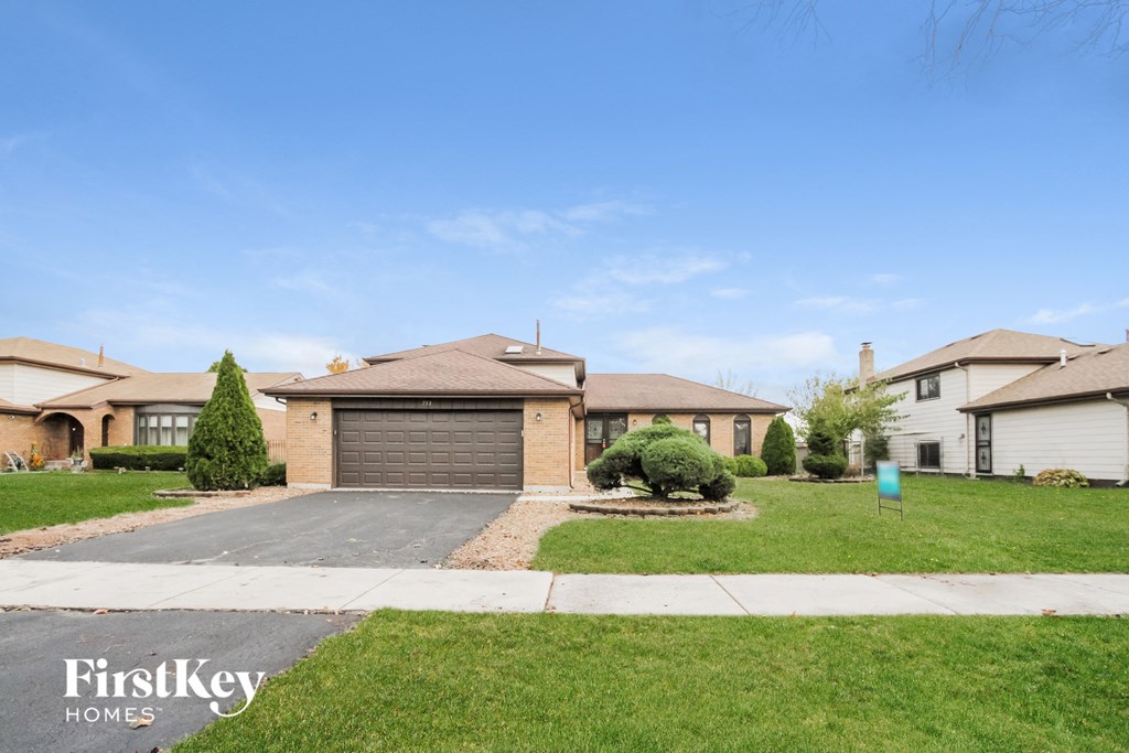 A residential area with houses and a clear sky.