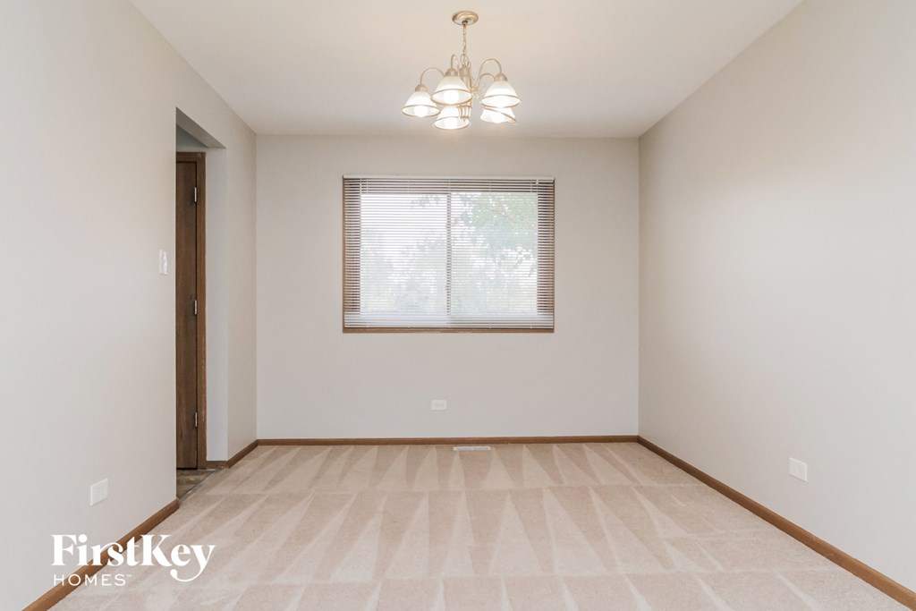 A room with a window and a door.