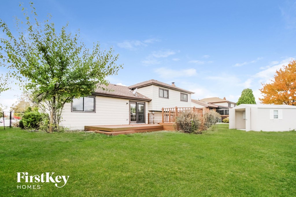 A house with a tree in front of it.