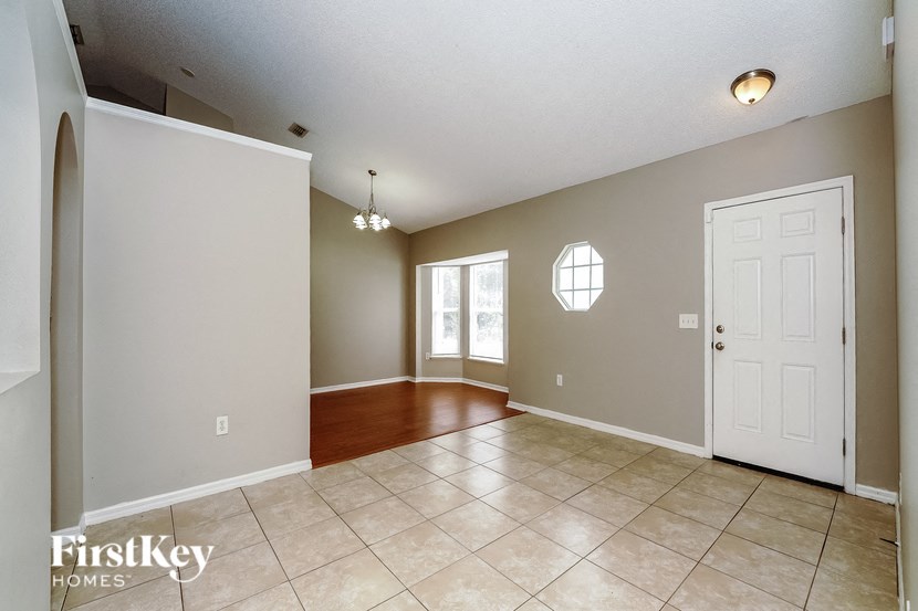 the dining room is open to the kitchen and living room