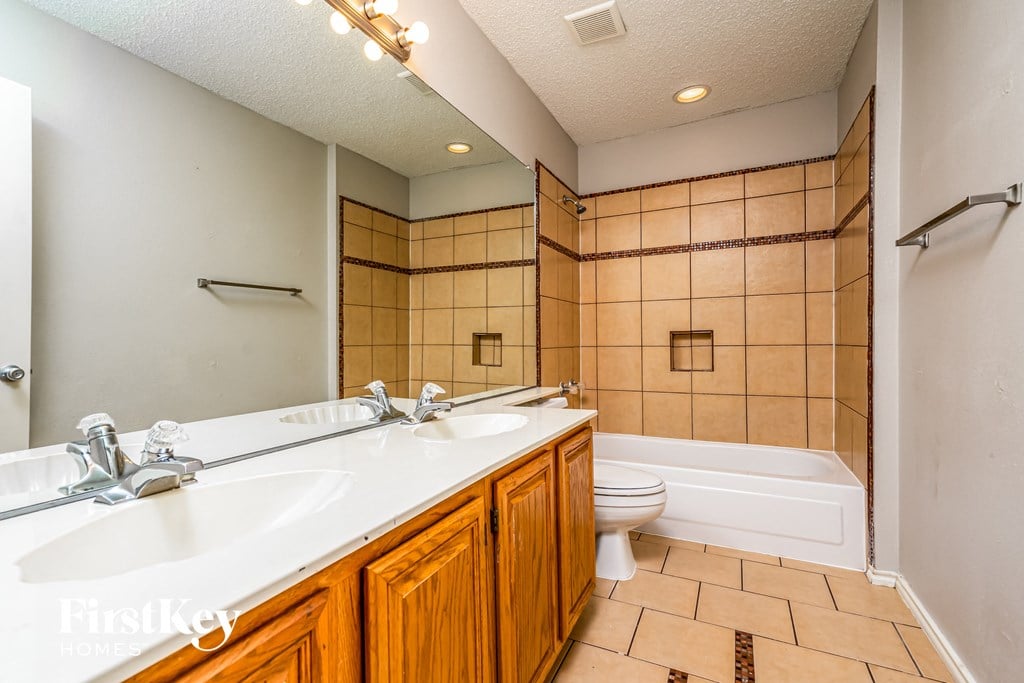 a bathroom with a sink and a toilet and a tub