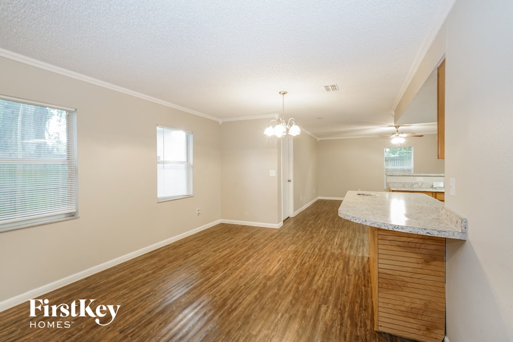 the living room and dining room with hardwood flooring and a kitchen island