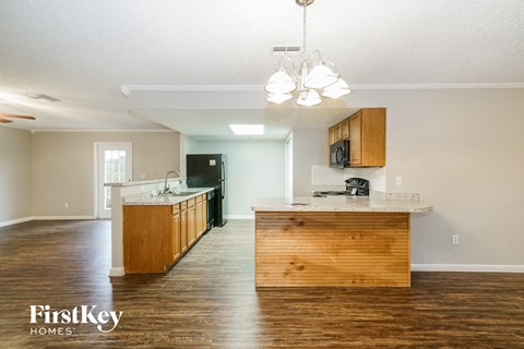 a kitchen with wooden cabinets and a counter top