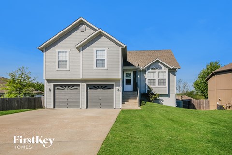 A two-story house with a garage is for sale by FirstKey Homes.